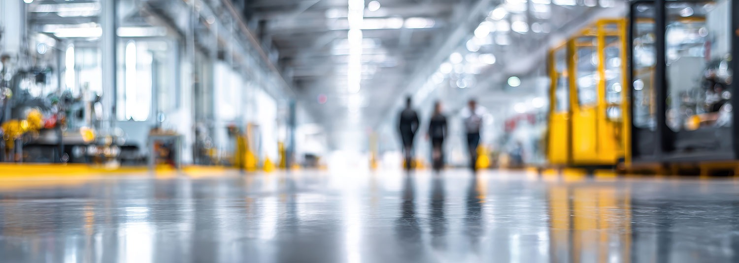 An image of workers walking on a shop floor.